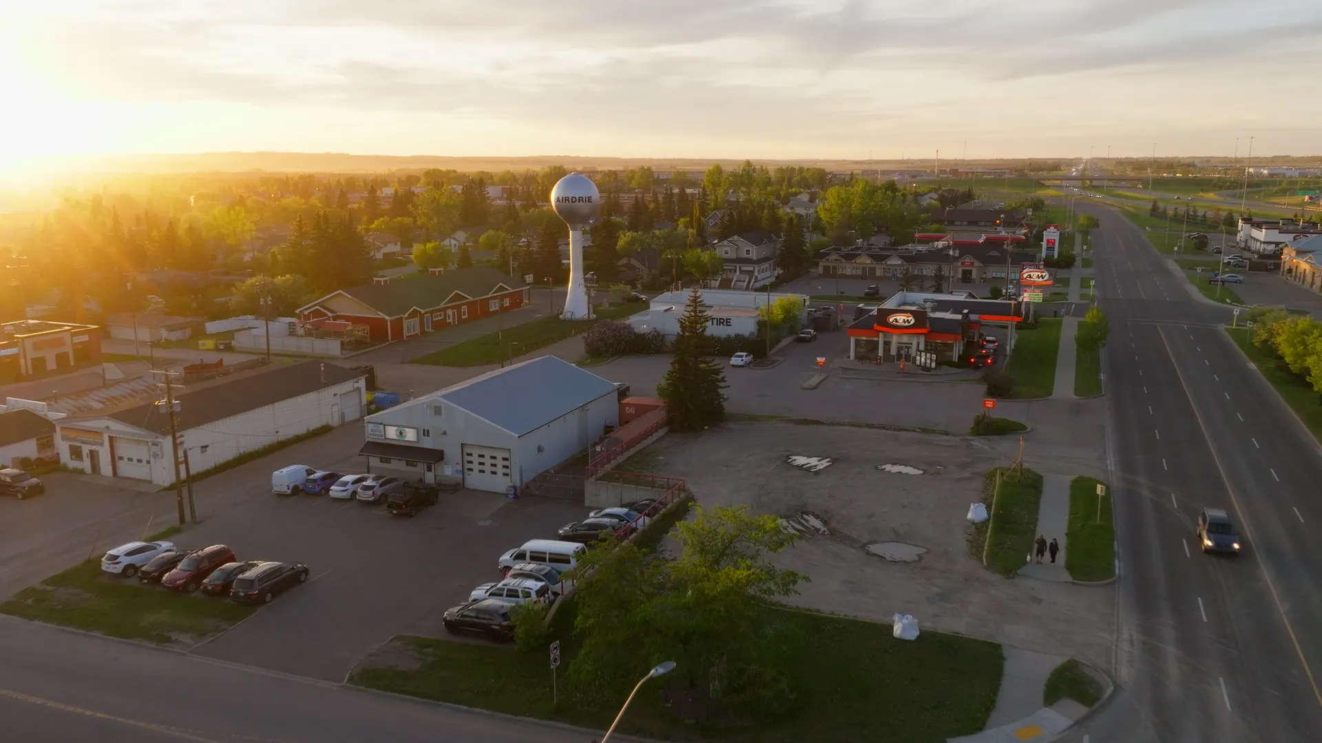 Aerial view over central Airdrie streets and businesses