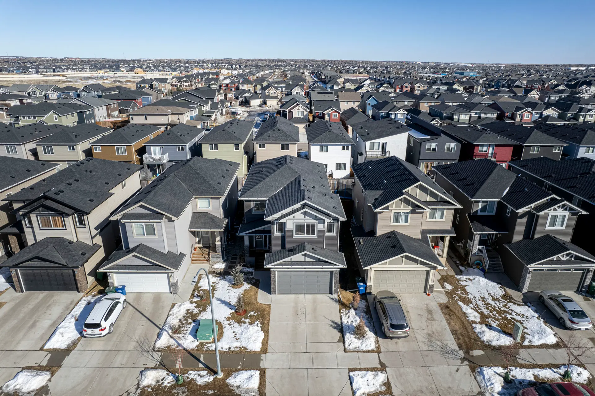 Aerial view of newer detached homes in Bayview Airdrie