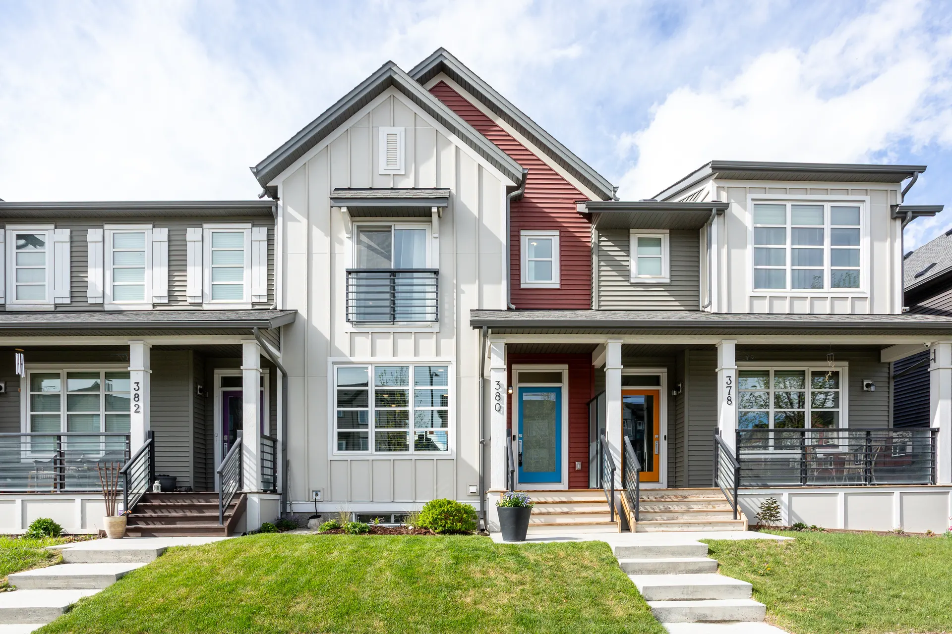 Front elevation of a two-storey paired home in Belmont, Calgary SW