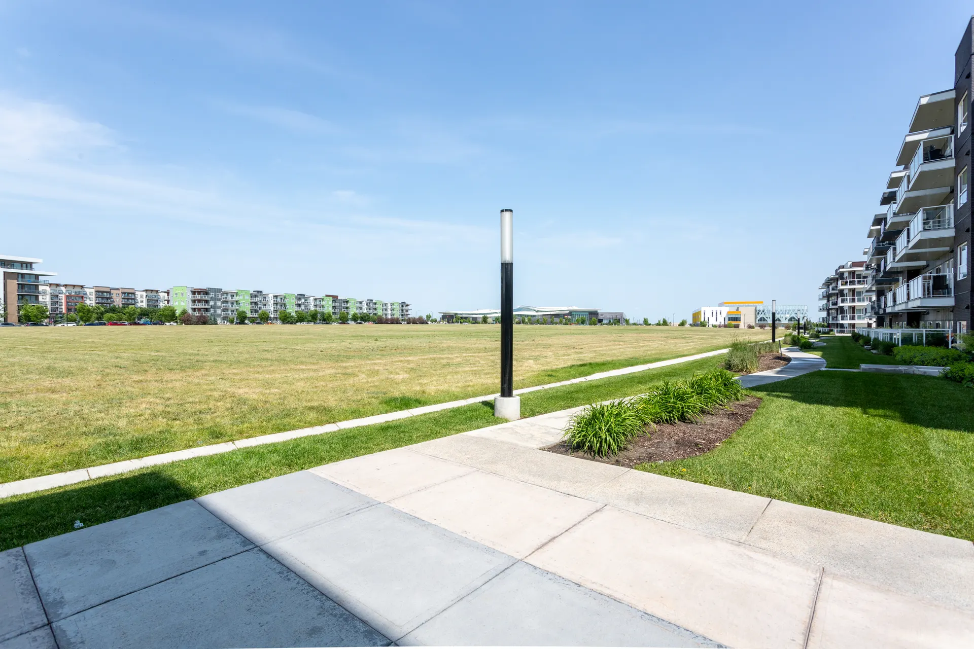Landscaped pedestrian path beside open space in Seton